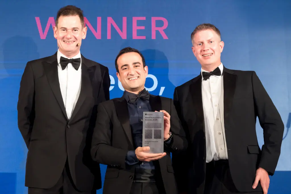 A person accepting an award on stage