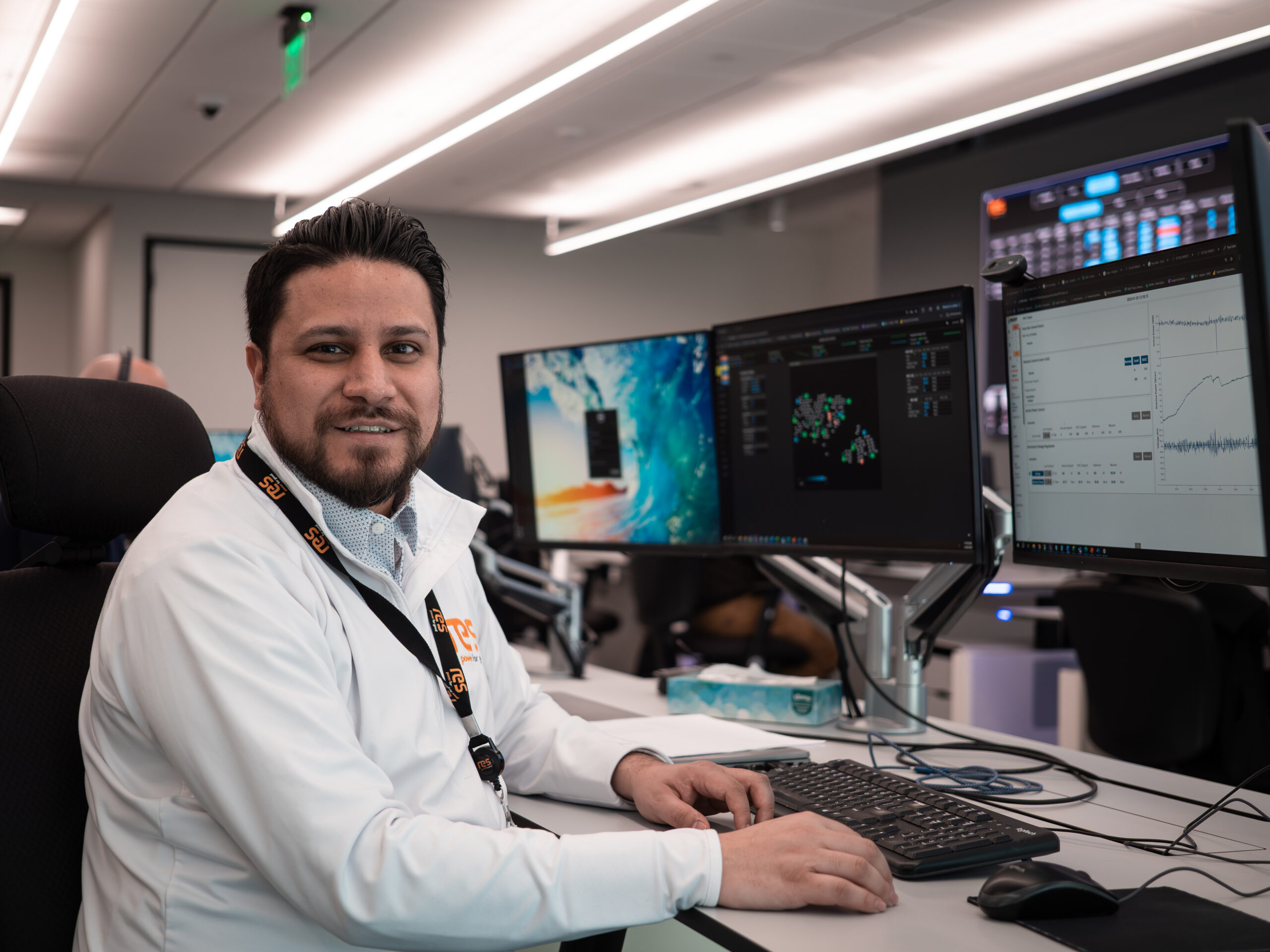 Gabe sat at a desk in the OCC in front of computer monitors